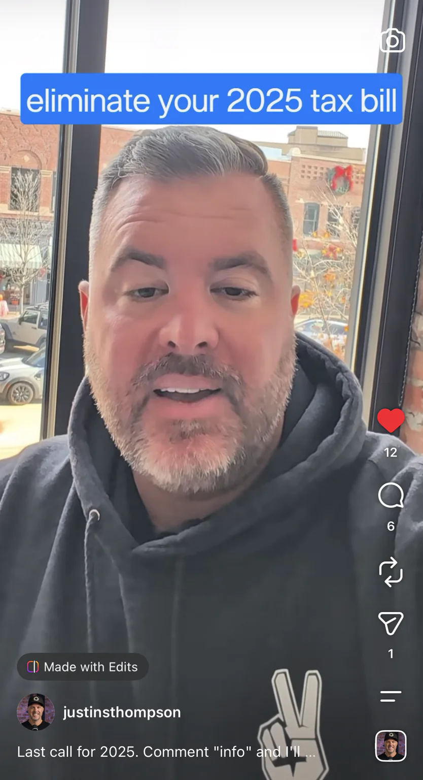 Justin Thompson filming a tax video on his phone by a window